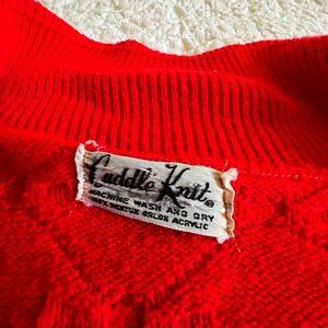 Cute vintage button down red poncho - has slits for your hands to go thru.